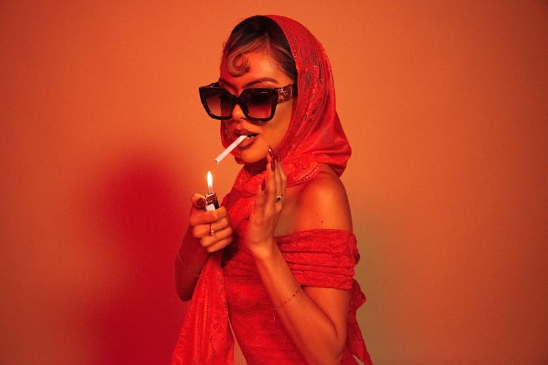 Close portrait in sunglasses, warm red light